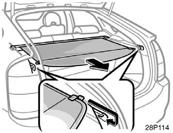 driving. To use the luggage cover, pull it out of the retractor and hook it on the anchors.