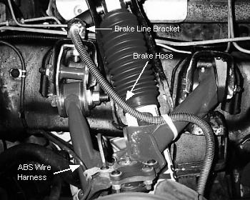 5. Attach the brake hose to the rear leg of the upper control arm with a tie wrap from kit 8062. See figure #15.