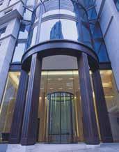 Concealed underfloor drive units in conjunction with all-glass CURVED door systems offer a