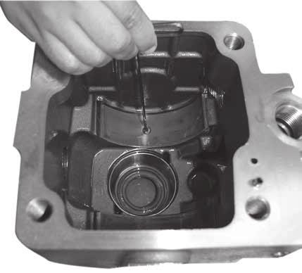 Note: The cradle bearings are asymmetrical. Install with longer side towards the top of the pump (controller side). 2. Insert the shaft bearing race 4.