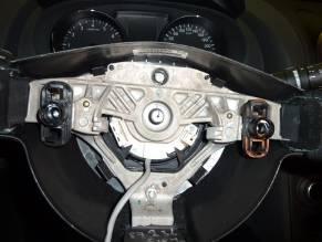 to separate. CAUTION: Do not move or remove spiral cable assembly located below steering wheel.