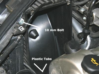 6) Remove the air ride connection that is located on the back of the air box assembly. First pop off the green vent clip with a small flat head screwdriver or pick.