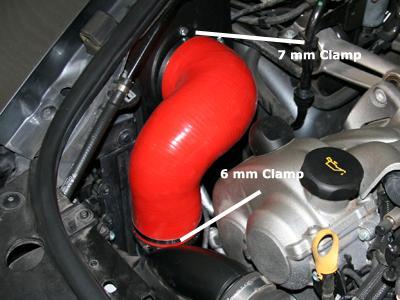 Re-install air ride connection. 12) Secure the top of the supplied V-Flow red silicone intake tube to the venturi using a 7 mm ratchet.