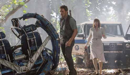 Chris Pratt and Bryce Dallas on the set of Jurassic World with suitable