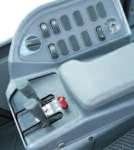The transmission automatically upshifts from first to second when the direction control lever is placed in reverse.