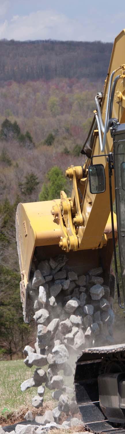 A Cat compactor prepares the area for the next phase of construction.