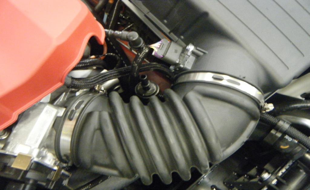 3. There are two (2) clamps that connect the stock air duct to the throttle body and airbox as shown by the red arrows in the