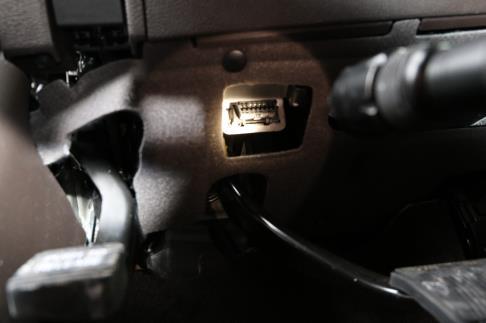 You may need to use your right hand fingers to guide from the front headlight panel opening and