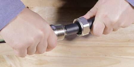 Move the sealing grommet into contact with the connector s barrel followed by the grommet nut. Tighten the grommet nut until it is hand-tight.