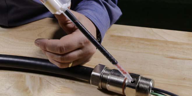Once the connector is assembled, weave the damming fiber between the conductors and wedge it into the connector s barrel using a non-metallic object.