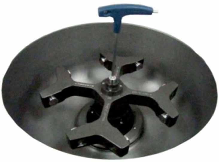 Grasp the rotor with one hand, and place Rotor Locking Tool at the center hole of the rotor.