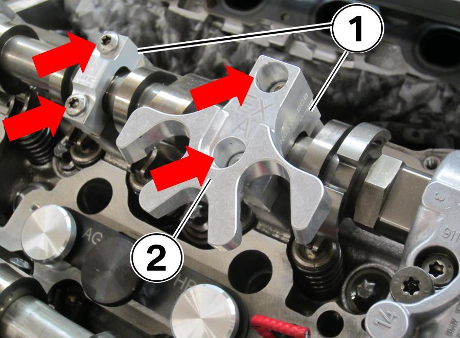 17. Install the two camshaft brackets (1).