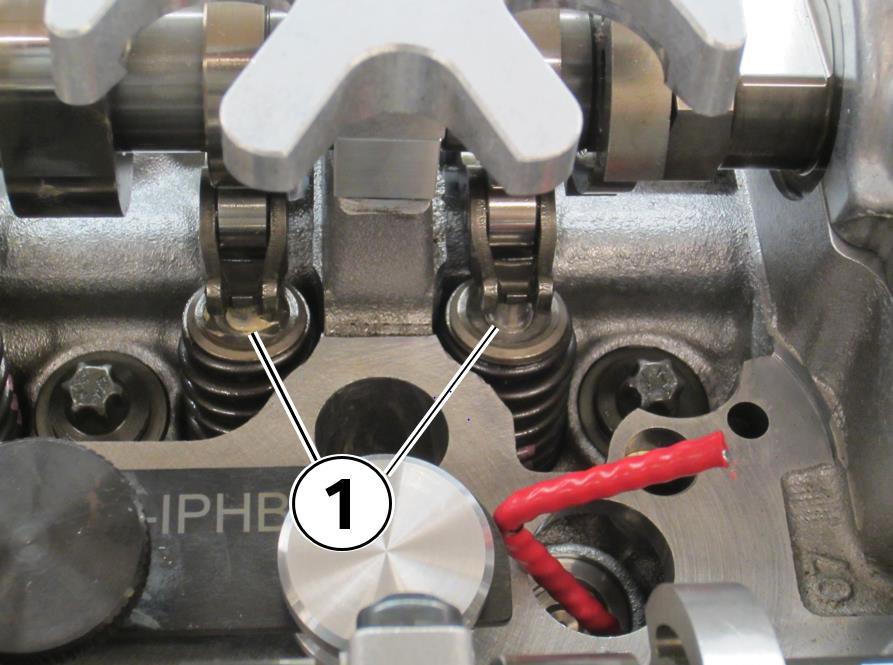 40. Rotate the compression nut (1) counter clockwise with the ratchet (2) until the compression rod compresses the valve Hold the locator handle (3) firmly to keep the compression rod properly