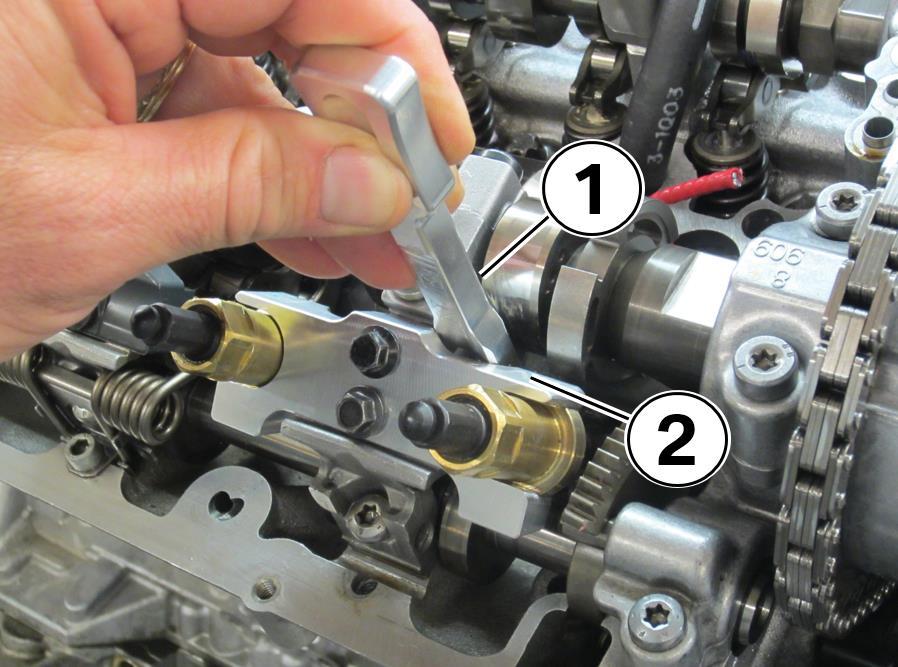 camshaft. Repeat steps 74-77 as needed. Repeat this process on the adjacent valve 78.