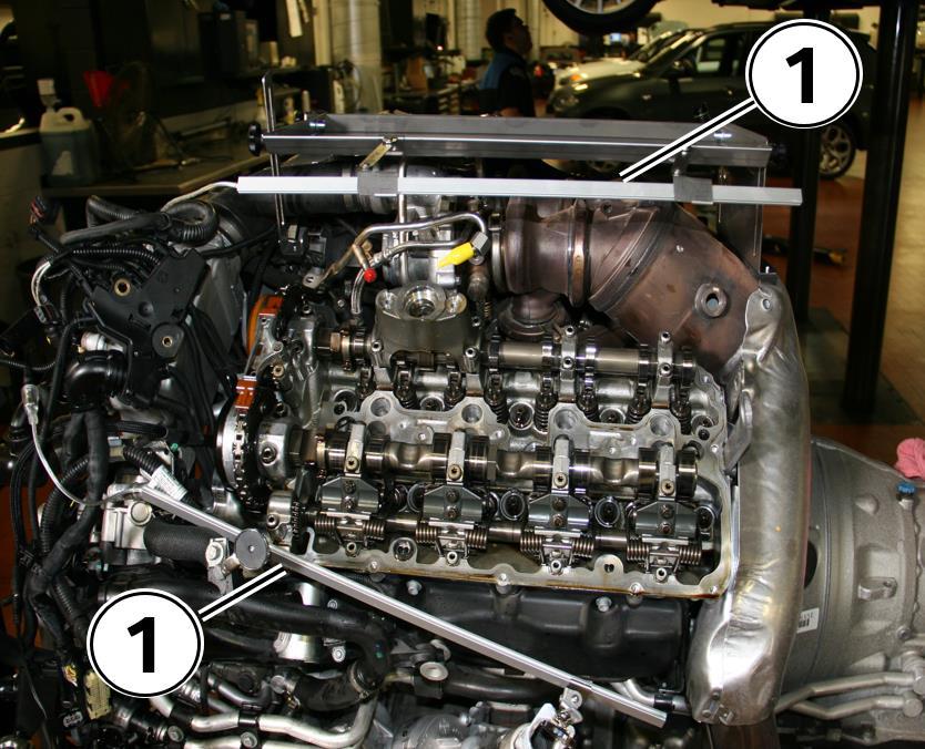 2. Engine removed from the vehicle and placed on the engine bench as per Repair Instruction 11 00 598 Removing and installing engine on front axle. 3. Engine preparation on table.