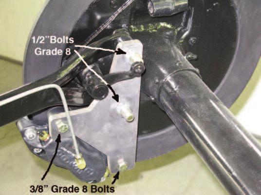 Installation Proceedure Page 2 2. Remove the two radius rod bolts from the rear brake backing plates. Install the new bolts provided and with spacers and the caliper brackets.