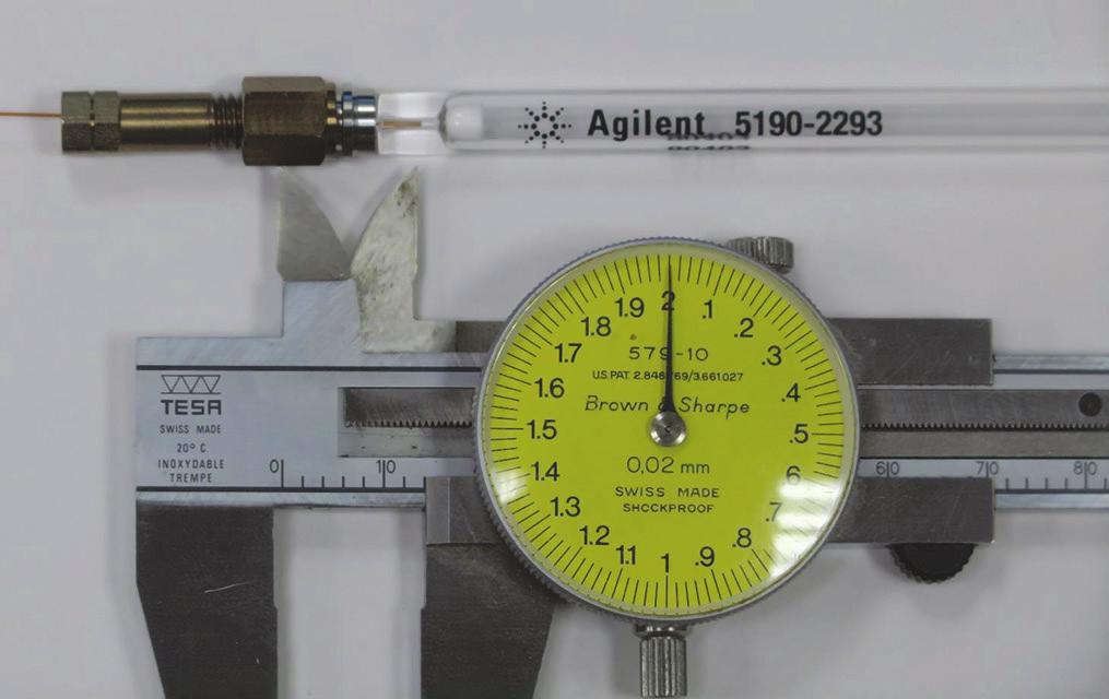 Column nut connected to free-spinning nut and weldment at an installation length of 1 mm with an Agilent liner (519 227) for scale.