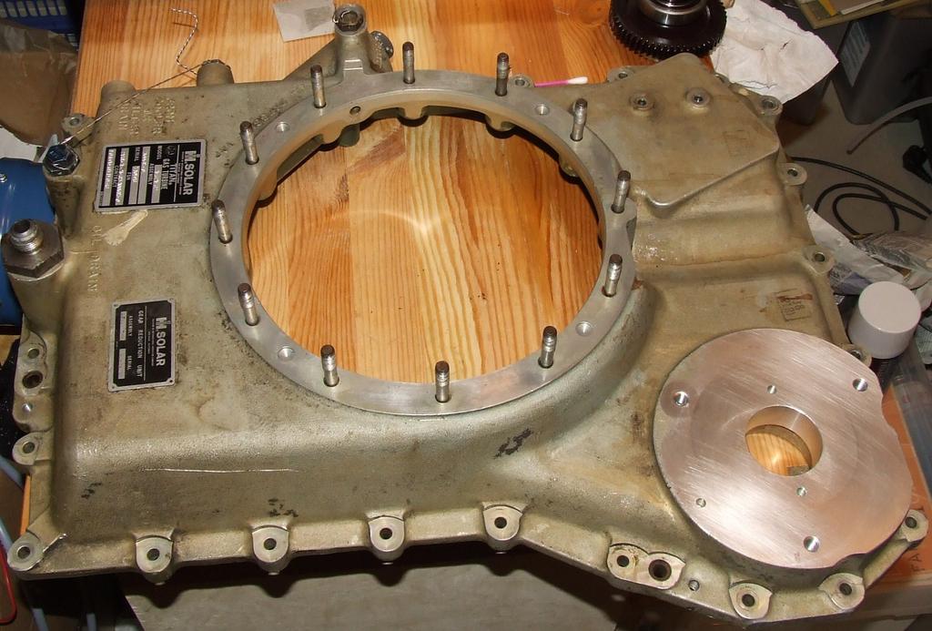 In order to accommodate the alternator, the (now removed) rear/upper gearbox casting needs to be modified. The photos show an already modified casting but the procedure is straight-forward.