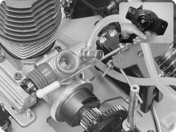 Pull the air filter assembly off the carburetor. Pull back on the throttle trigger. The carburetor barrel should slide open completely and the brake should be disengaged.