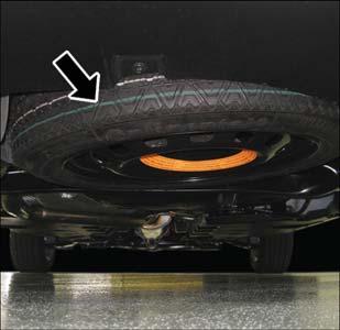 Spare Tire Removal The spare tire is stowed in underneath the rear cargo area on the outside of