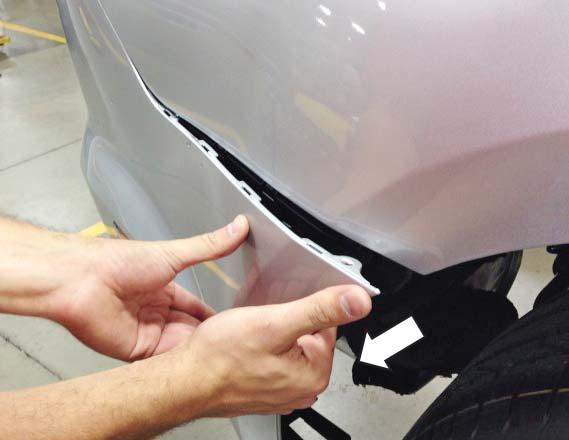 10. Hold the center of the bumper cover