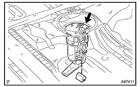 d. Remove the fuel suction with pump and gauge tube from the fuel tank. NOTE: - Do not damage the fuel pump filter.