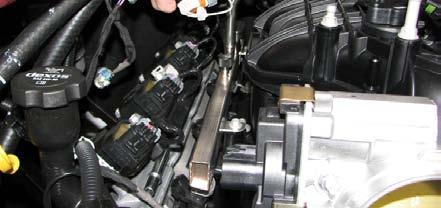 Disconnect the EVAP solenoid hoses and unplug the EVAP harness.