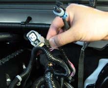 Install the supplied fuel supply line extension by inserting the male end into the main fuel supply line.