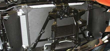 66. Using a 10mm socket, remove four (4) lower bolts on the front A-frame brace located behind the radiator shroud.