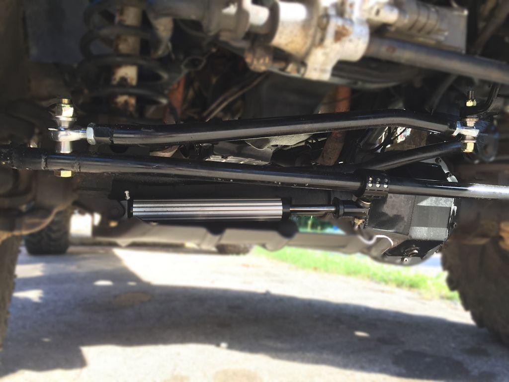 Steering installed in a 3 to 6 configuration, with the drag link below the pitman arm. This is done using a drop pitman arm that has a reverse taper, required on all lift heights over 4.