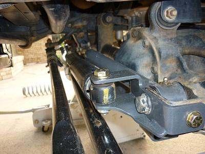 7. Tighten the track bar bolt to 125 ft-lbs (170 N-m). 8. Install the Poly Performance 8003 Tie rod clamp.