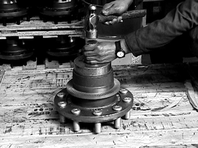 Lightly coat the outer surface of the spindle with grease to reduce the chance of the inner wheel bearing cocking upon installation of the hub. Figure 20 5.