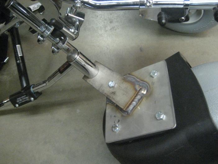 The large pins pictured in Figure 18 were welded on to the foot bar from the end with the smaller radius.