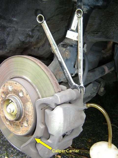 18. The caliper should come off. Do NOT overly flex, or allow the caliper to hang by the brake line. Doing so may damage the brake line.