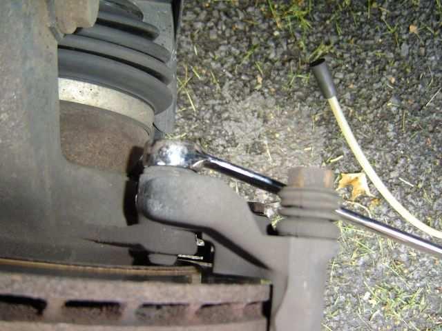 caliper on the strut tower. 19. Take the 17mm wrench and remove the caliper carrier (also know as the torque member, or caliper frame) bolts. These bolts are very tight.