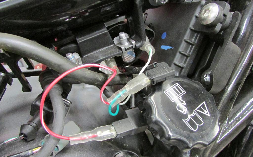 L Stk 15 Plug the in-line of the stock wiring harness and ignition coil (Fig. L).