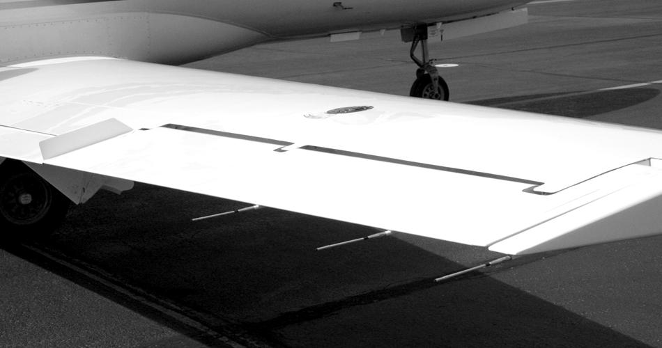 CITATION MUSTANG OPERATING MANUAL This door opens the tail cone baggage compartment (Figure 1-11), which holds 300 pounds. Figure 1-12. Wing Trailing Edge Figure 1-11.