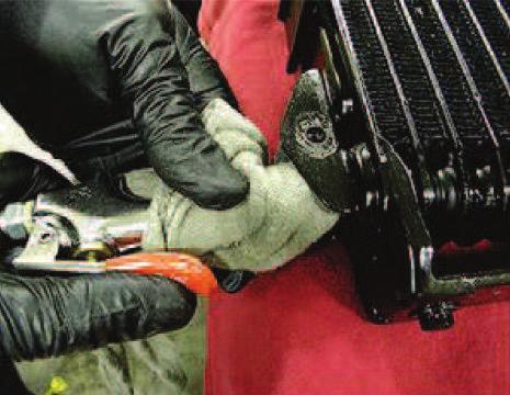 8. Insert the tip of an air gun into the end of the auxiliary fluid cooler inlet. (Figure 8) 9. Wrap a shop rag around the air gun tip and end of the cooler inlet to reduce blowback. (Figure 8) 10.