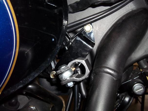 Install the steering damper bracket/clamp assembly to the
