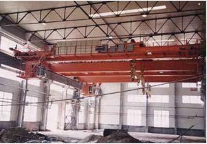 This is a special kind of crane with two purposes; the lifting system is the grab bucket or the electromagnetism tray.