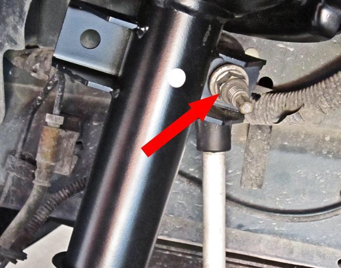 35. Support the lower suspension and strut assembly. 36. If equipped, reattach the strut tower brace. 37.