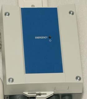USING THE EMERGENCY STOP BUTTON on the Control Box On the front side of the control box is a small recessed button marked emergency.
