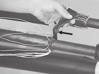 2 For Jacketed Concentric Neutral and Flat Strap Neutral Cables: Unfold neutral wires and force the wires into the applied mastic.
