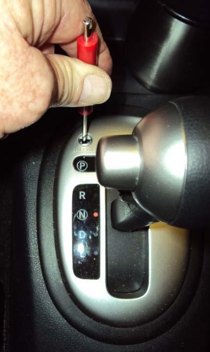 Take caution not to damage cover or console. c. Insert screwdriver into slot and push down. At the same time move shifter to Neutral ( N ). d. Re-install shift lock cover. 3.