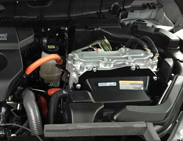 Appendix C: NISSAN ROGUE HYBRID - 12 Volt Battery located in the Trunk: Jump Start & Recharging locations. 1. Remove fuse cover. 2. Remove red (+) terminal cover. 3.