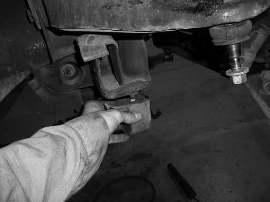 Remove the four bolts/clamps from the yoke and remove the front driveshaft from the differential