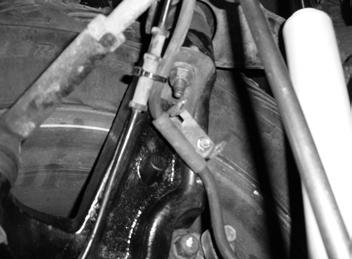 Attach the second brake hose bracket to the holes in the back side of the steering knuckle with a provided 1/4 x 3/4 bolt and washer (BP 572). Torque to 10 ft-lbs (Fig 40A). 66.