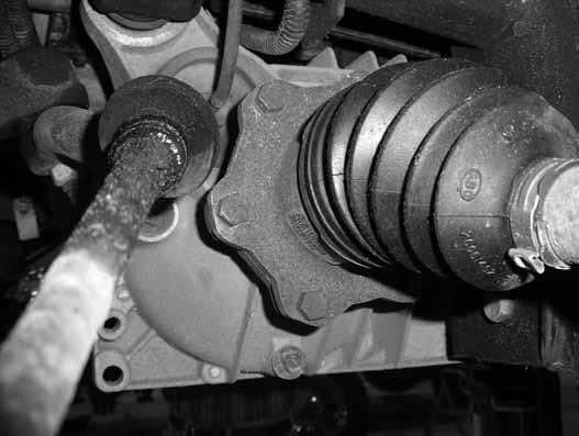 Allow the knuckle to swing out and remove the CV axle from the hub (Fig 10). Mark the CV axle to indicate DRV side and PASS side. FIgure 10 20.