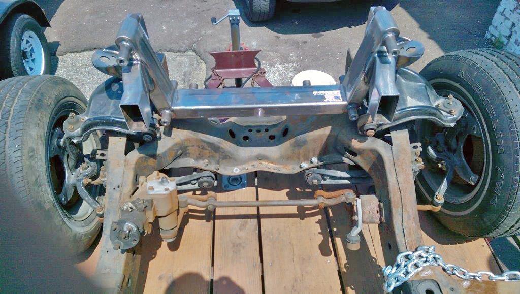 Add additional jack stands in front of and behind the stock spring pockets if you haven t done so already. Clean the frame of all the old suspension components.