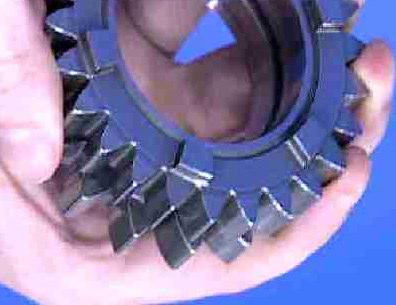 Each gear is made up of two gear cogs that together make up a ratio. One gear, the pinion gear, is on the main shaft coming off the clutch.